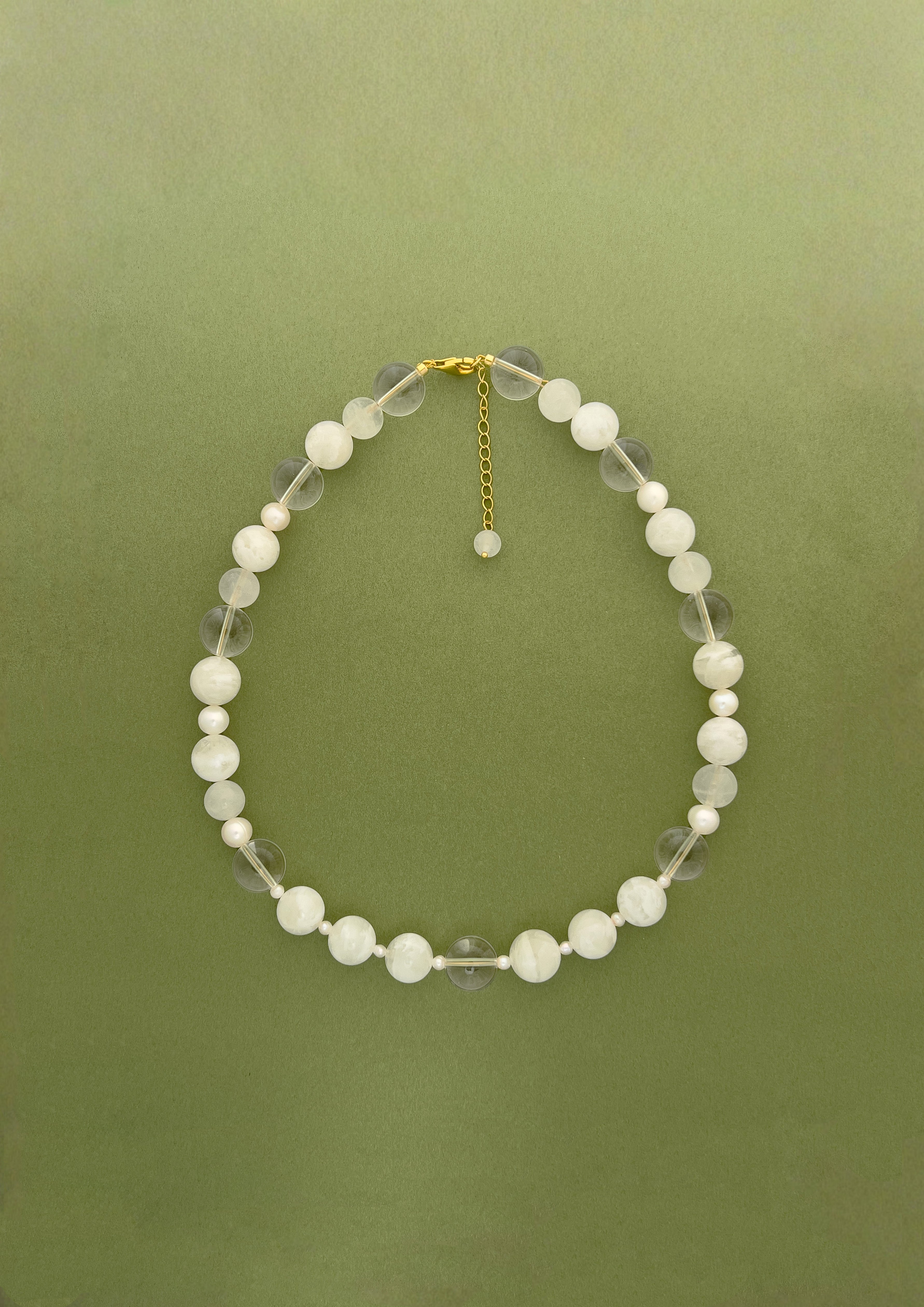 Amaré Qi collection main image featuring ethereal White Phantom Quartz and White Jade jewelry, representing the flow of vitality and inner peace.
