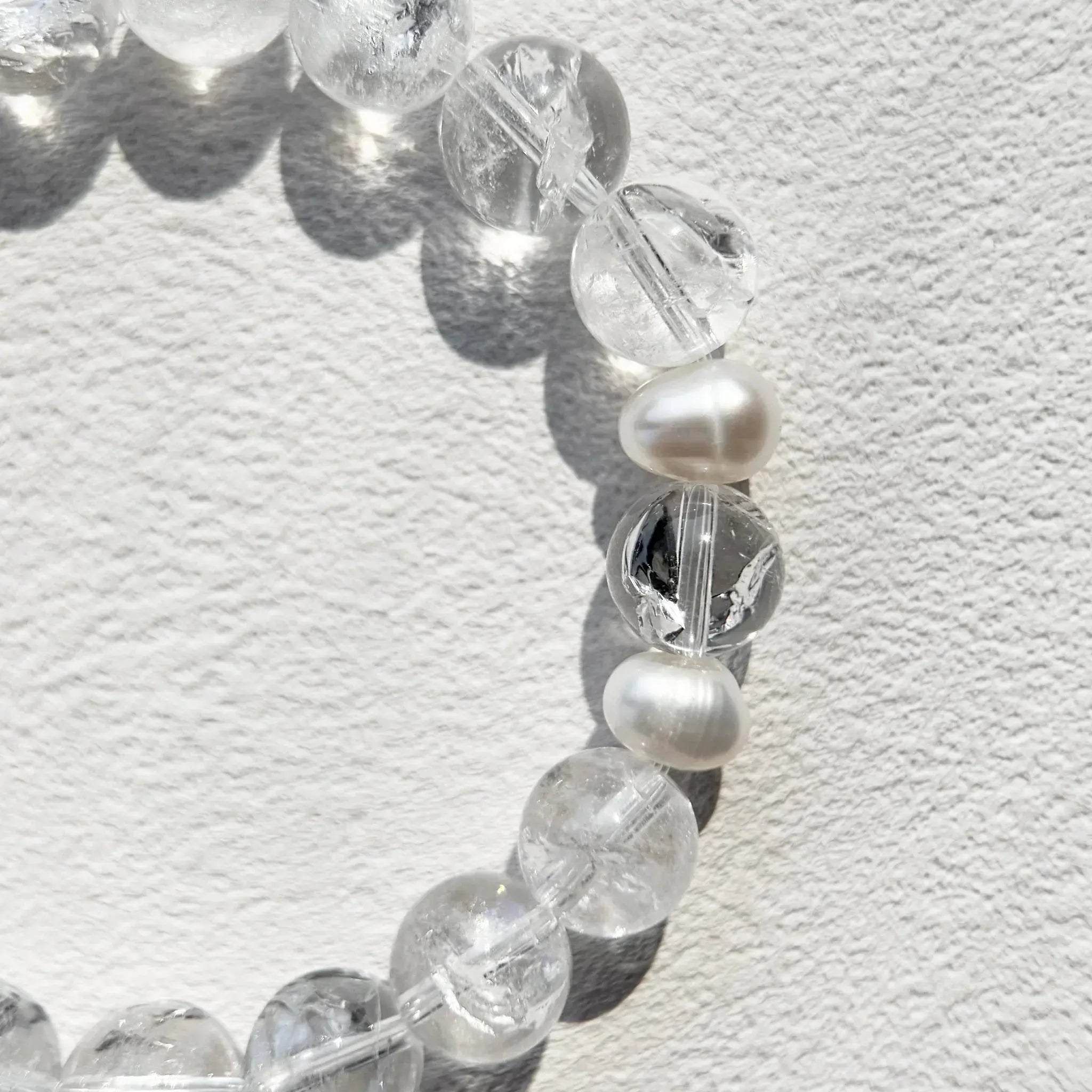 Close-up of Azeztulite beads showing clarity and healing energy