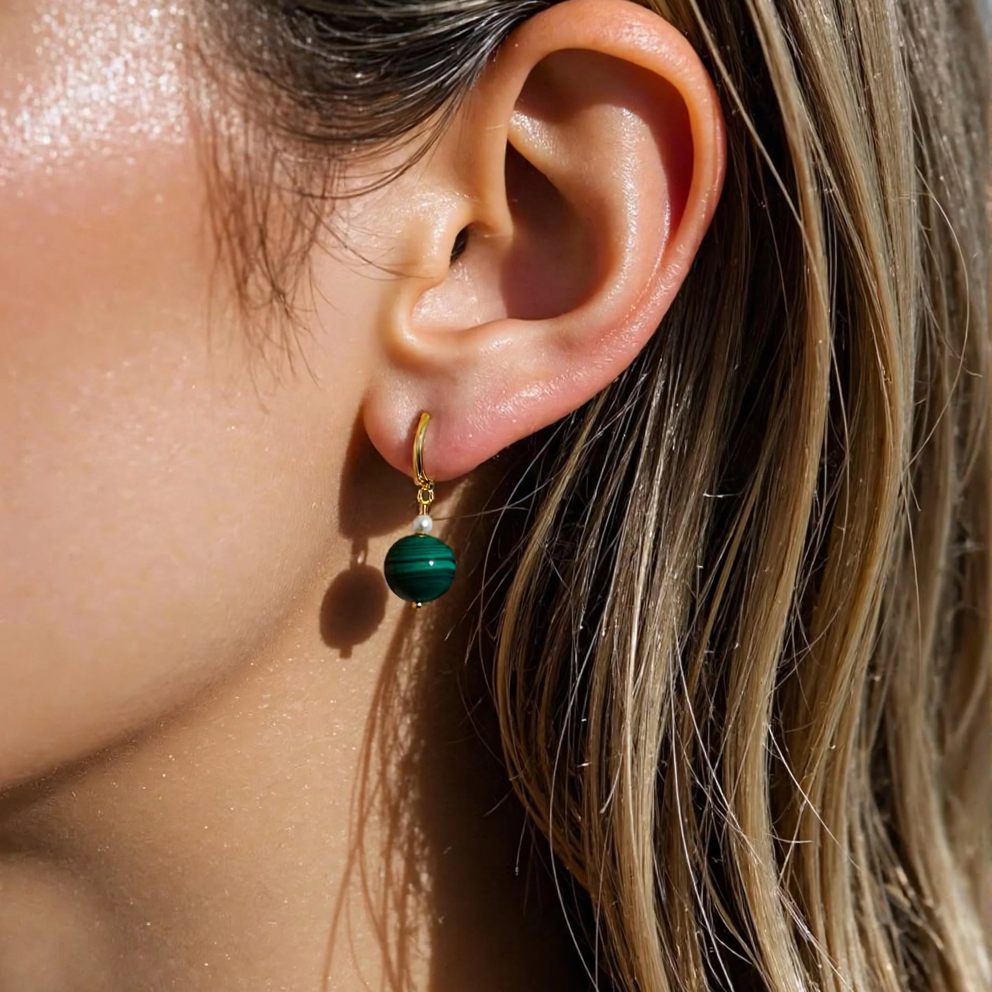 Model wearing handmade Malachite earrings with freshwater pearls – grounding and protective gemstone jewelry