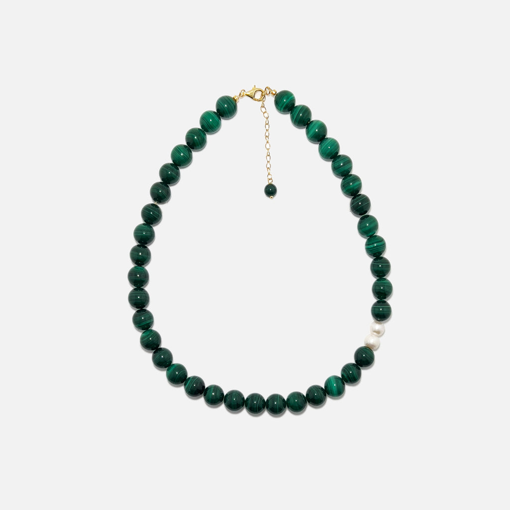 Handmade Malachite crystal necklace with freshwater pearls on white background, rich green tones and stylish design.