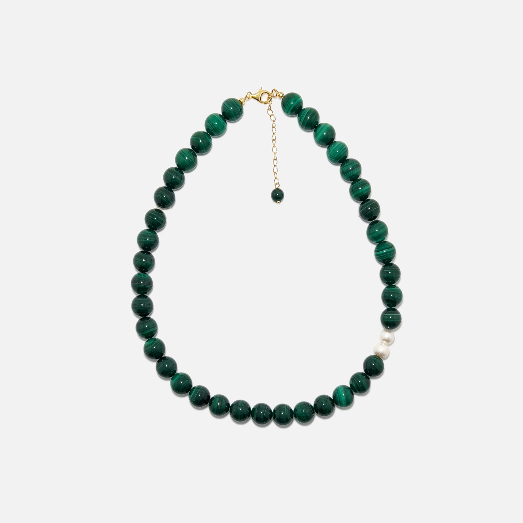 Handmade Malachite crystal necklace with freshwater pearls on white background, rich green tones and stylish design.