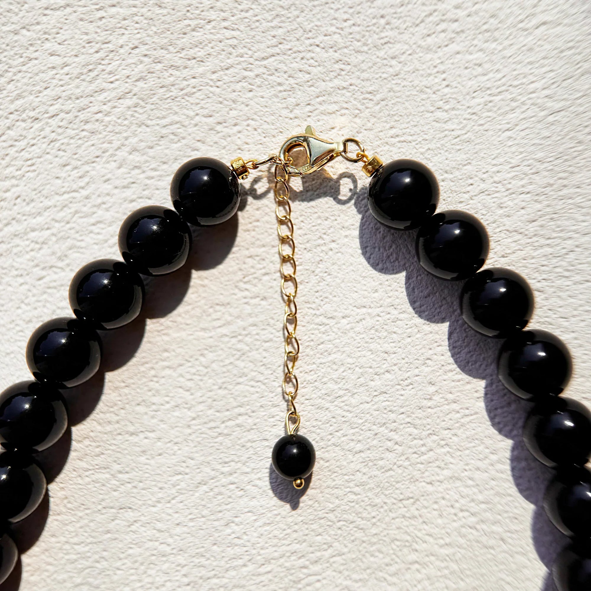 Close-up of Obsidian beads for shielding and clarity