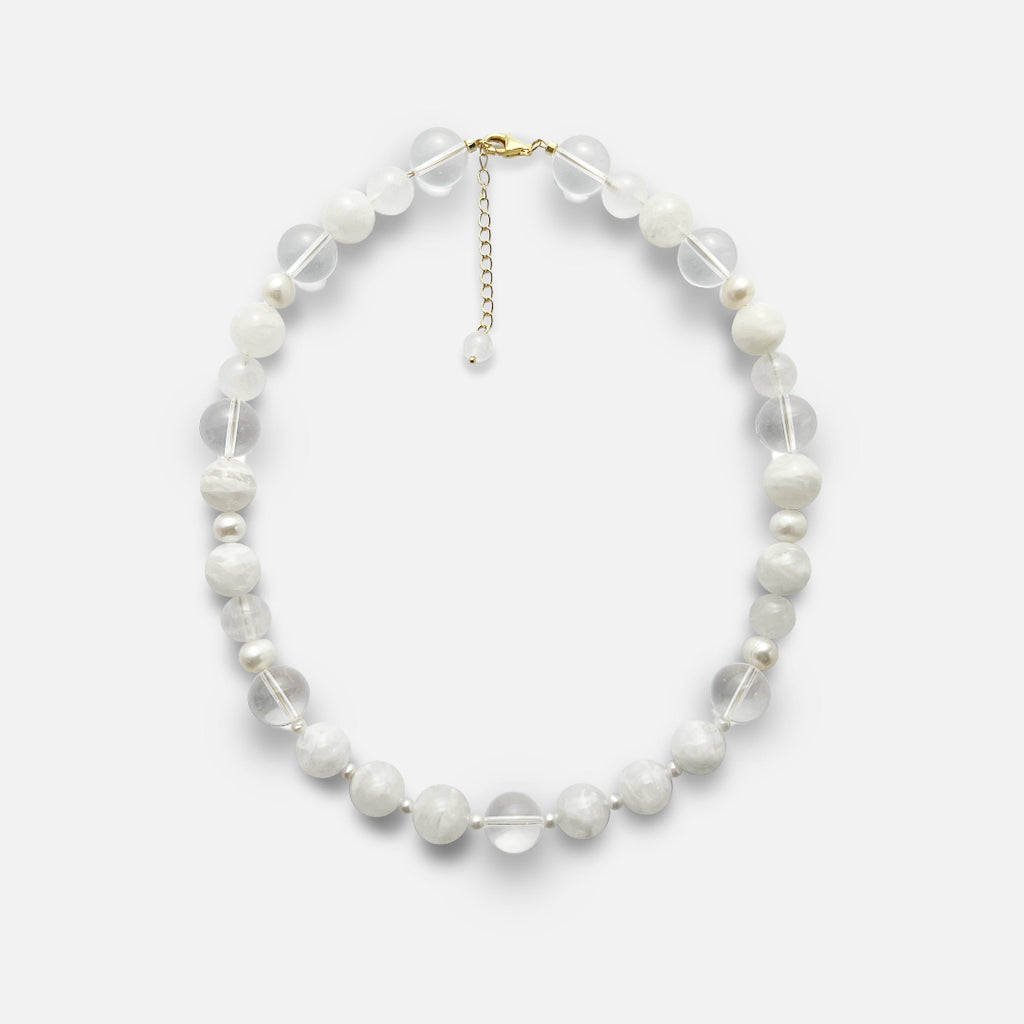 Amaré Qi necklace from the void & form collection, featuring 12mm clear quartz, 12mm white phantom quartz, 10mm white jade, and mixed-size freshwater pearls on an 18k gold chain.