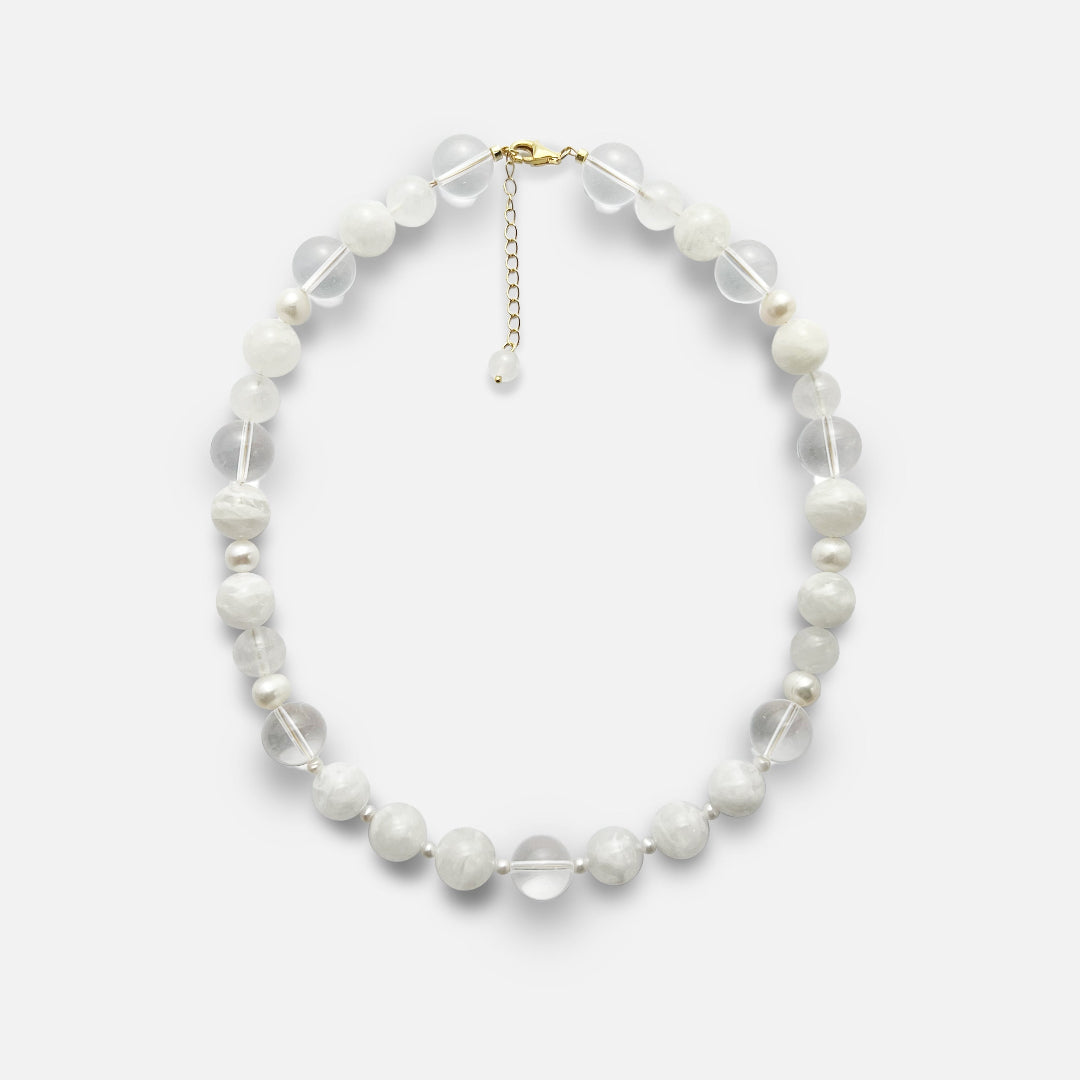Amaré Qi necklace from the void & form collection, featuring 12mm clear quartz, 12mm white phantom quartz, 10mm white jade, and mixed-size freshwater pearls on an 18k gold chain.