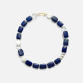 Amaré Qinghua Necklace featuring a misty white jade stone, deep blue lapis lazuli, and a lustrous freshwater pearl on an 18k gold chain, void and form collection, minimalist white background.
