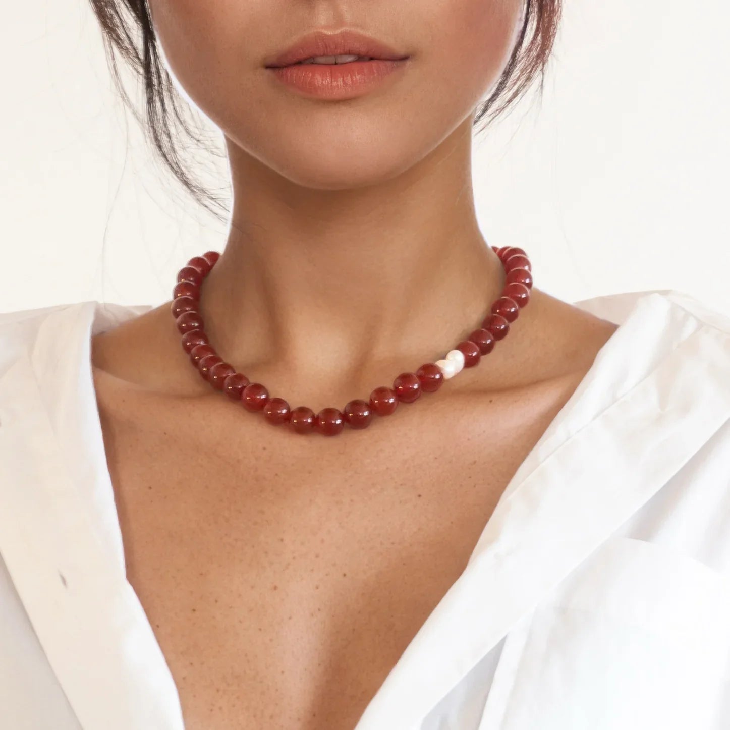 Red Agate necklace worn to boost confidence and bold energy