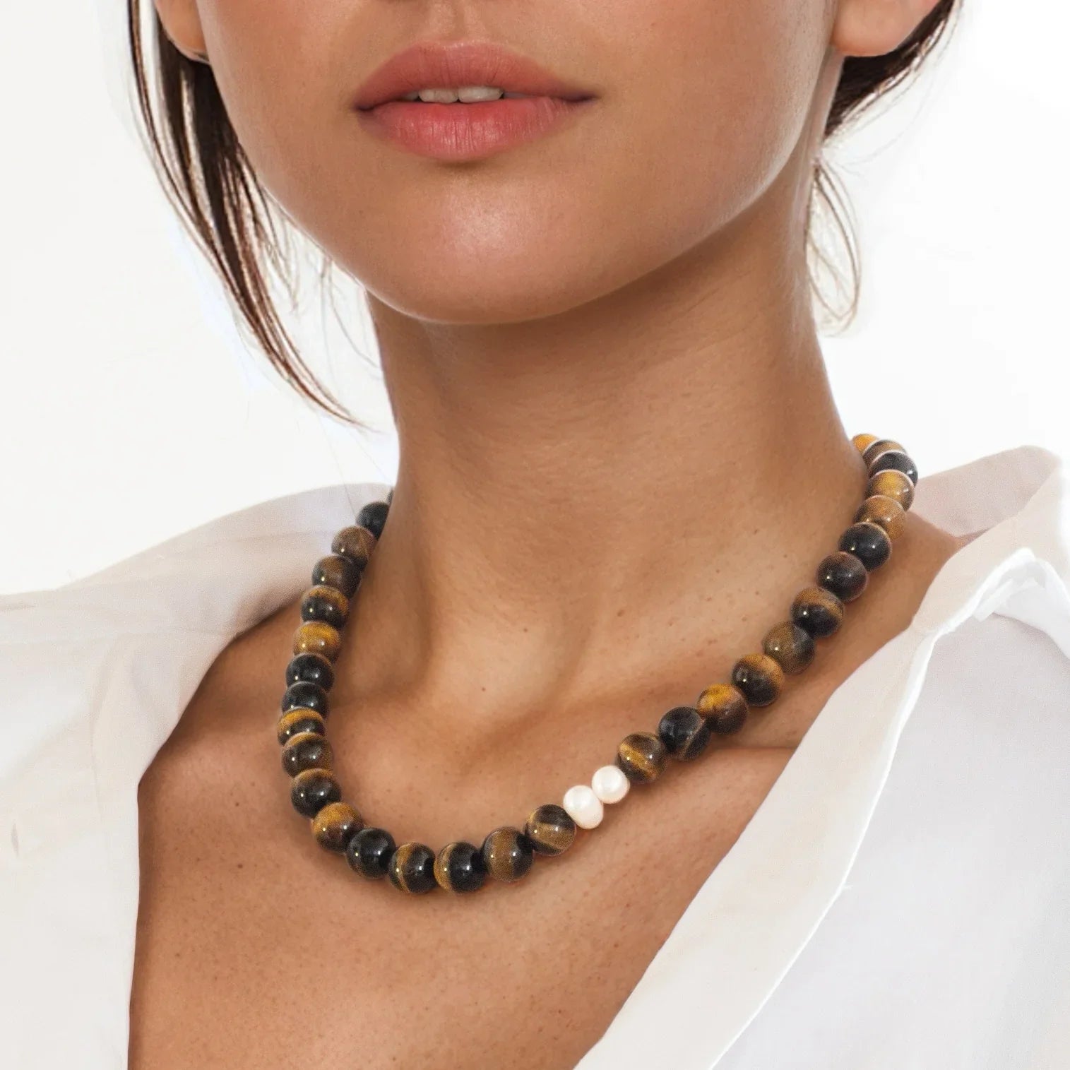 Tiger’s Eye necklace styled on model for courage and protection
