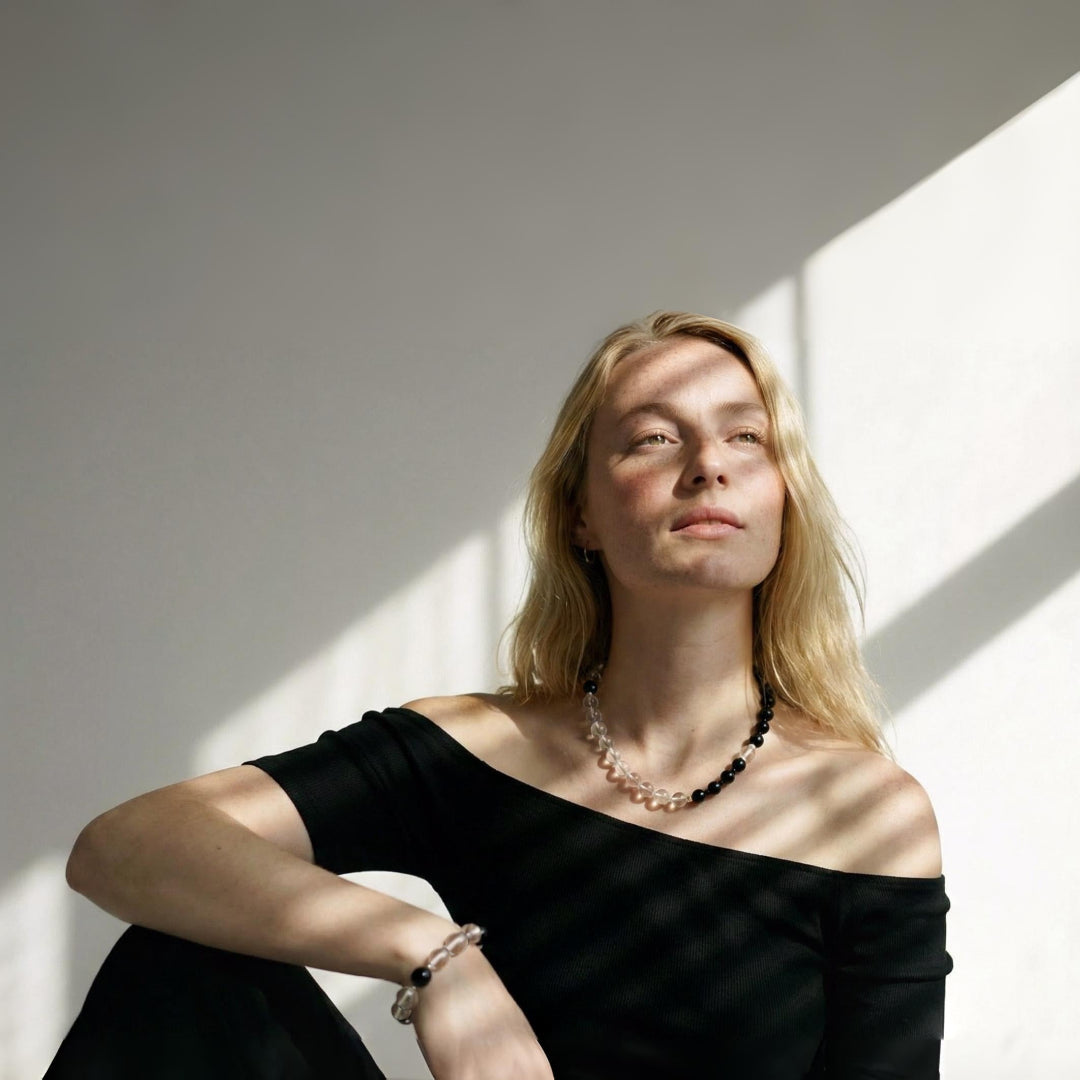 Lifestyle image of the Yinyang necklace styled as a wearable ritual of balance, highlighting its elegant drape and spiritual presence in everyday wear.