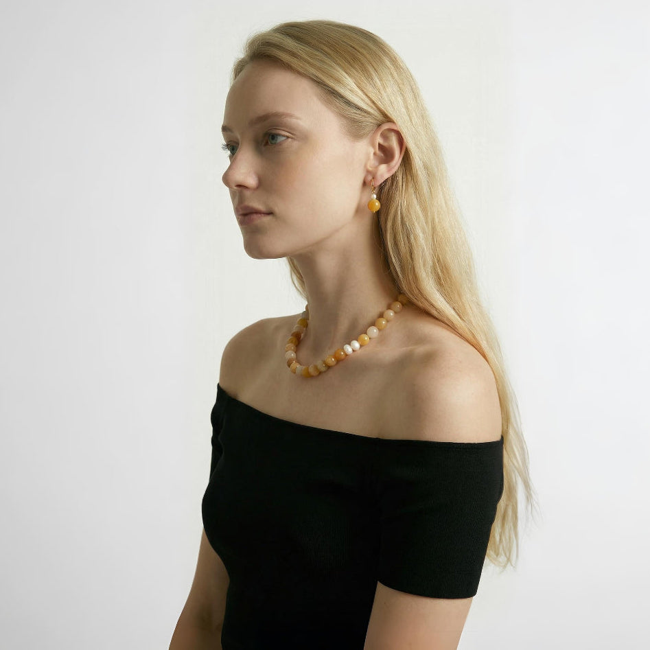 Model wearing Amaréluz Yellow Aventurine Necklace and Earrings