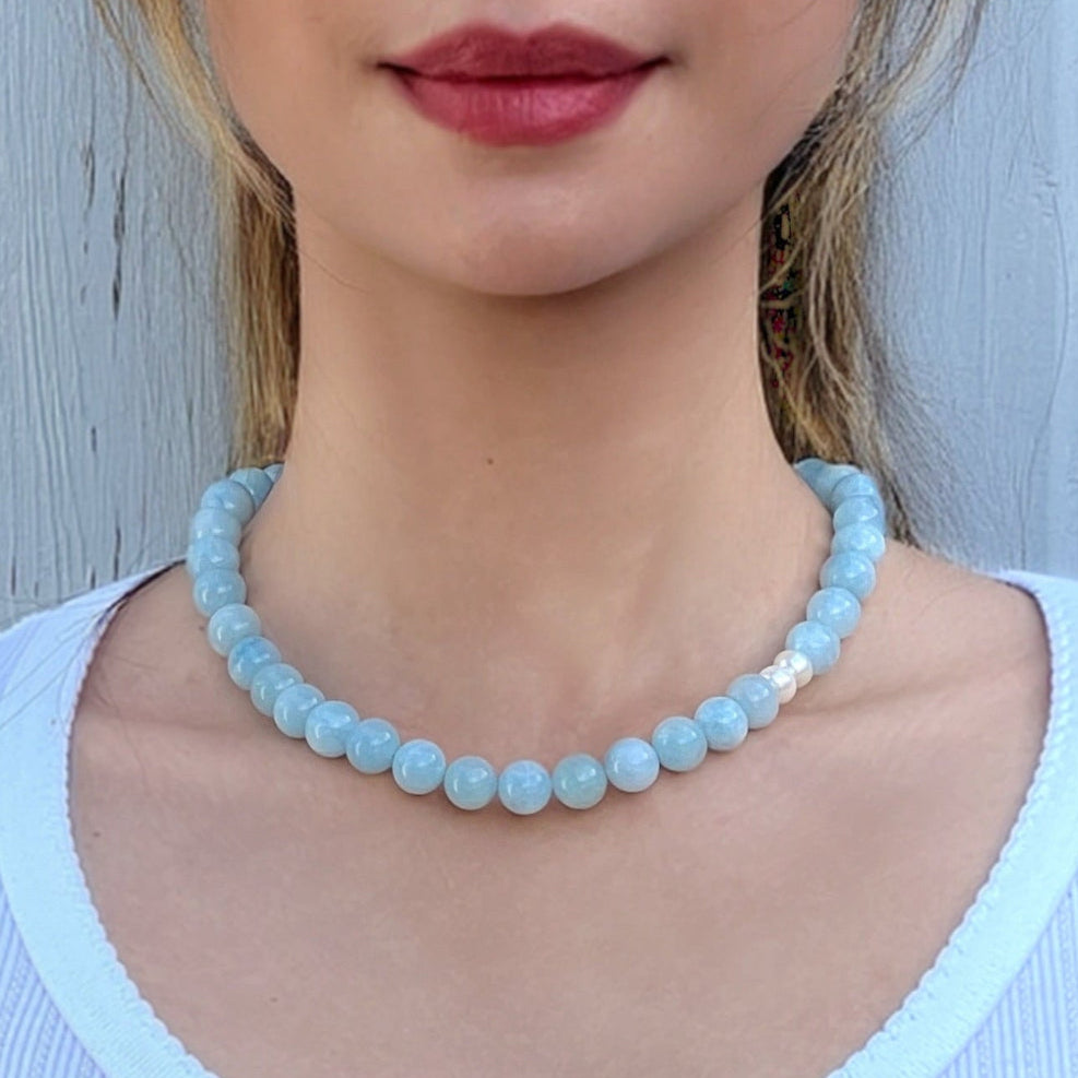 Model wearing handmade Aquamarine crystal necklace – stylish jewelry for calm energy and clarity