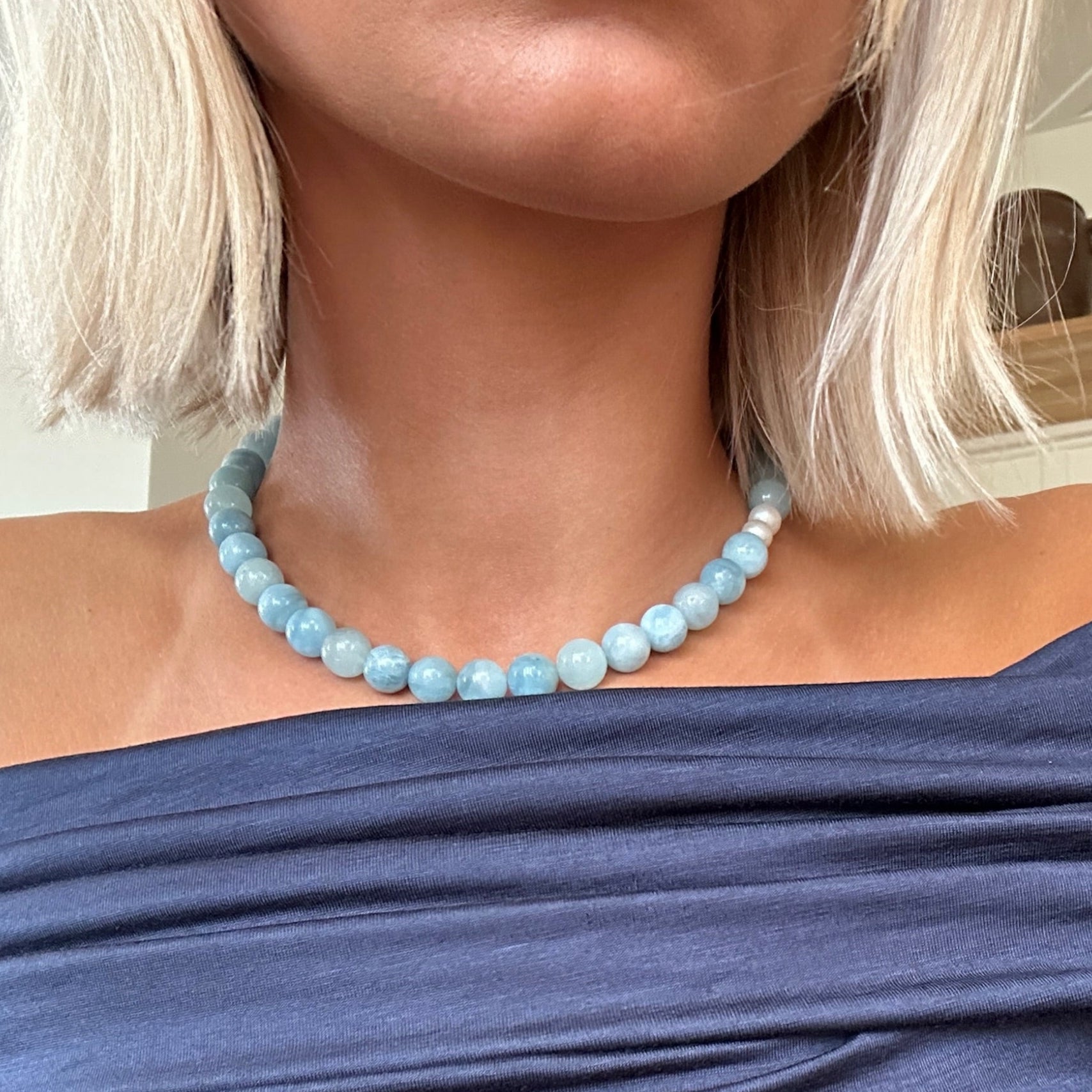 Model wearing handmade Aquamarine crystal necklace – stylish jewelry for calm energy and clarity