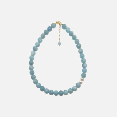 Handmade Aquamarine crystal necklace with freshwater pearls on white background, calming and elegant design.