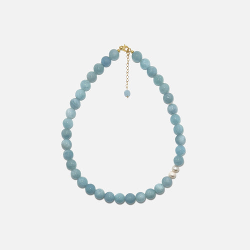 Handmade Aquamarine crystal necklace with freshwater pearls on white background, calming and elegant design.