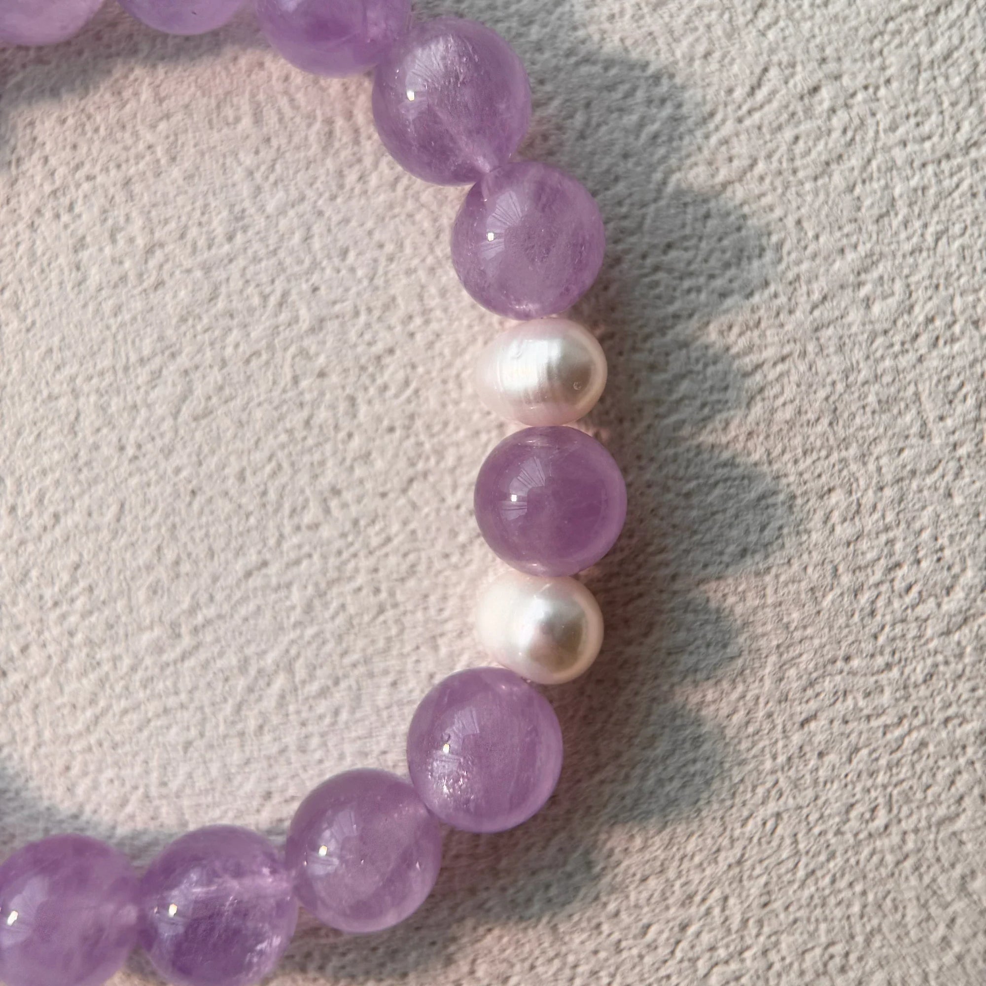Close-up of Lavender Amethyst beads for stress relief and claritydetail