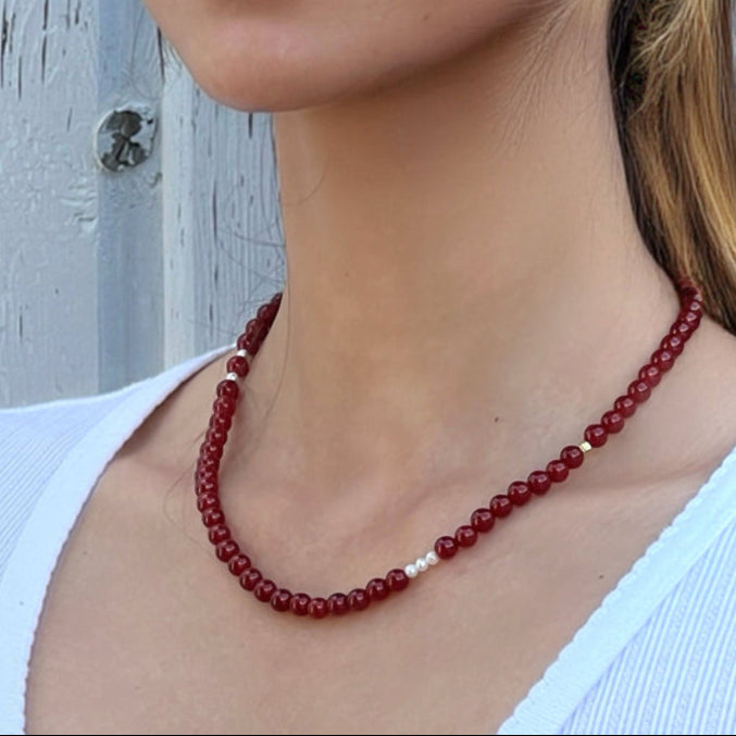 Red Agate Freya Necklace styled on model – handmade crystal jewelry for confidence and strength