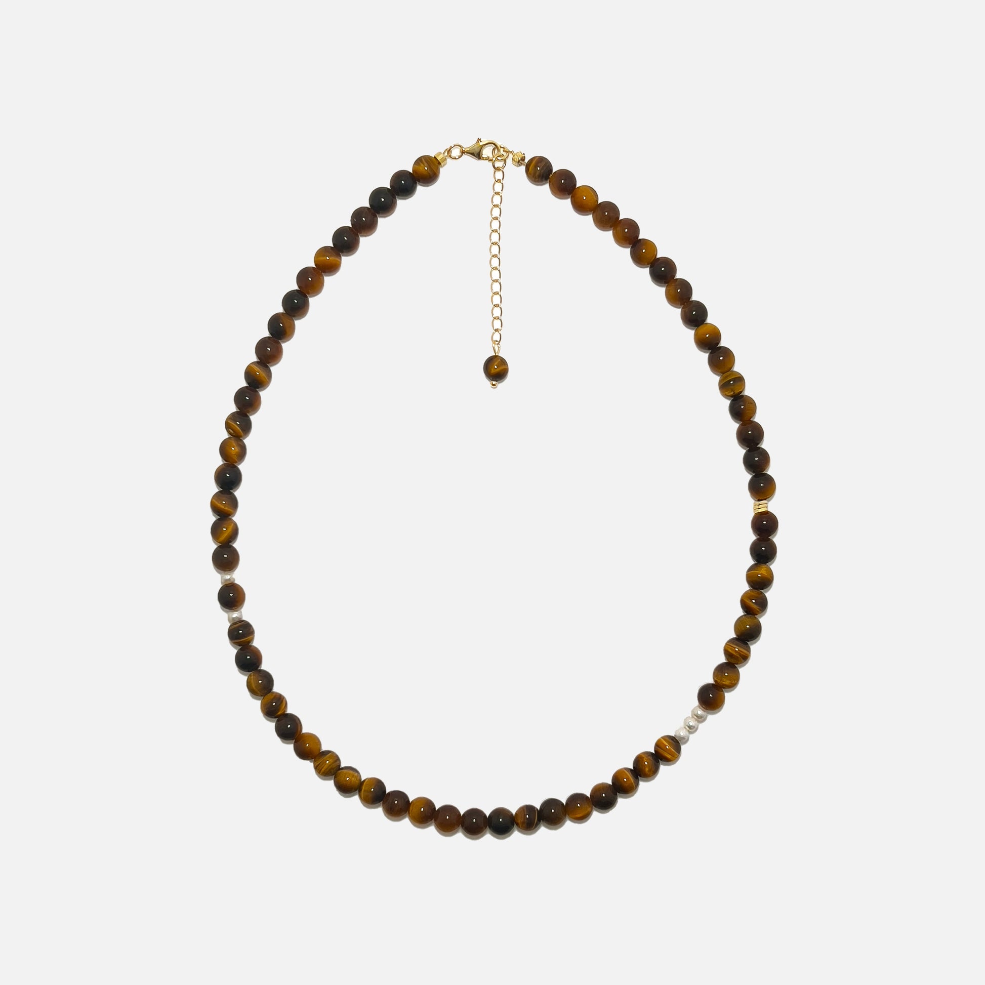 Tiger’s Eye crystal necklace with 6mm beads, freshwater pearls, and gold accents on a white background – handmade jewelry designed for confidence and inner strength.