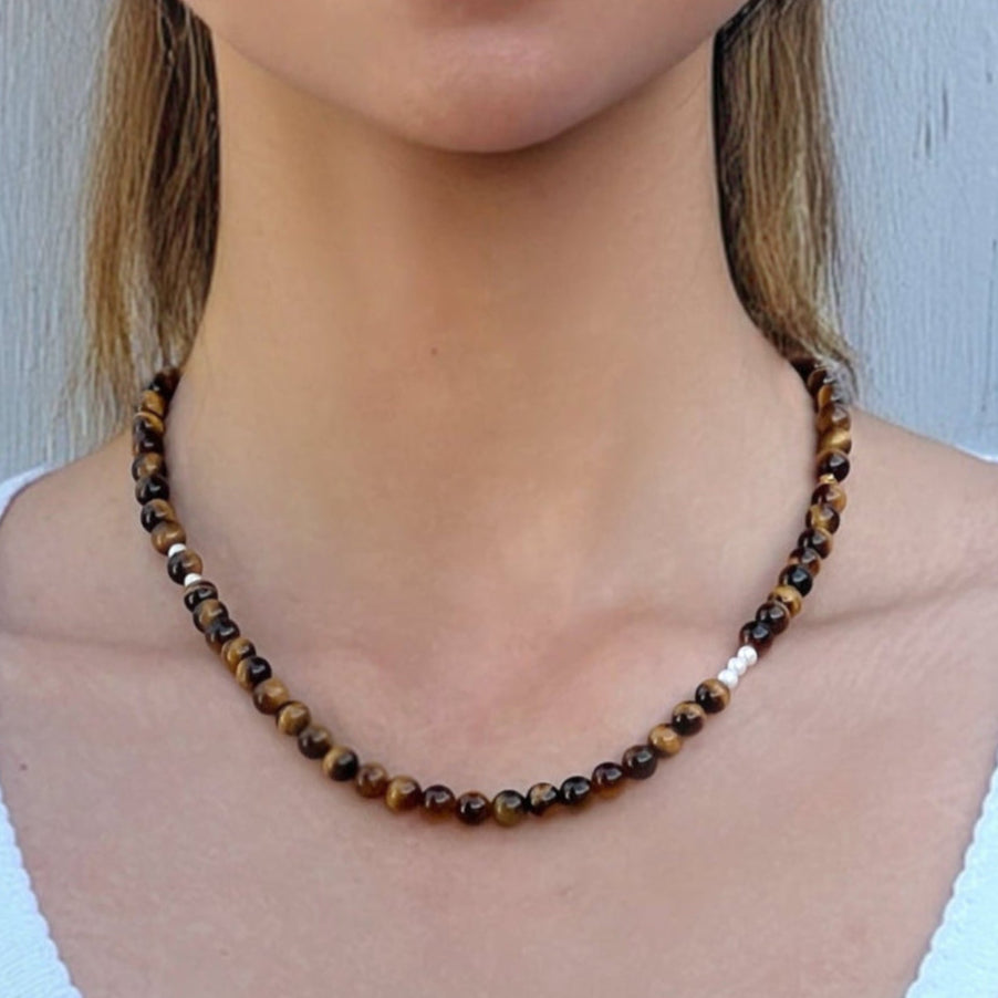 Model wearing the Tiger’s Eye Freya Necklace – handmade crystal jewelry for confidence and strength