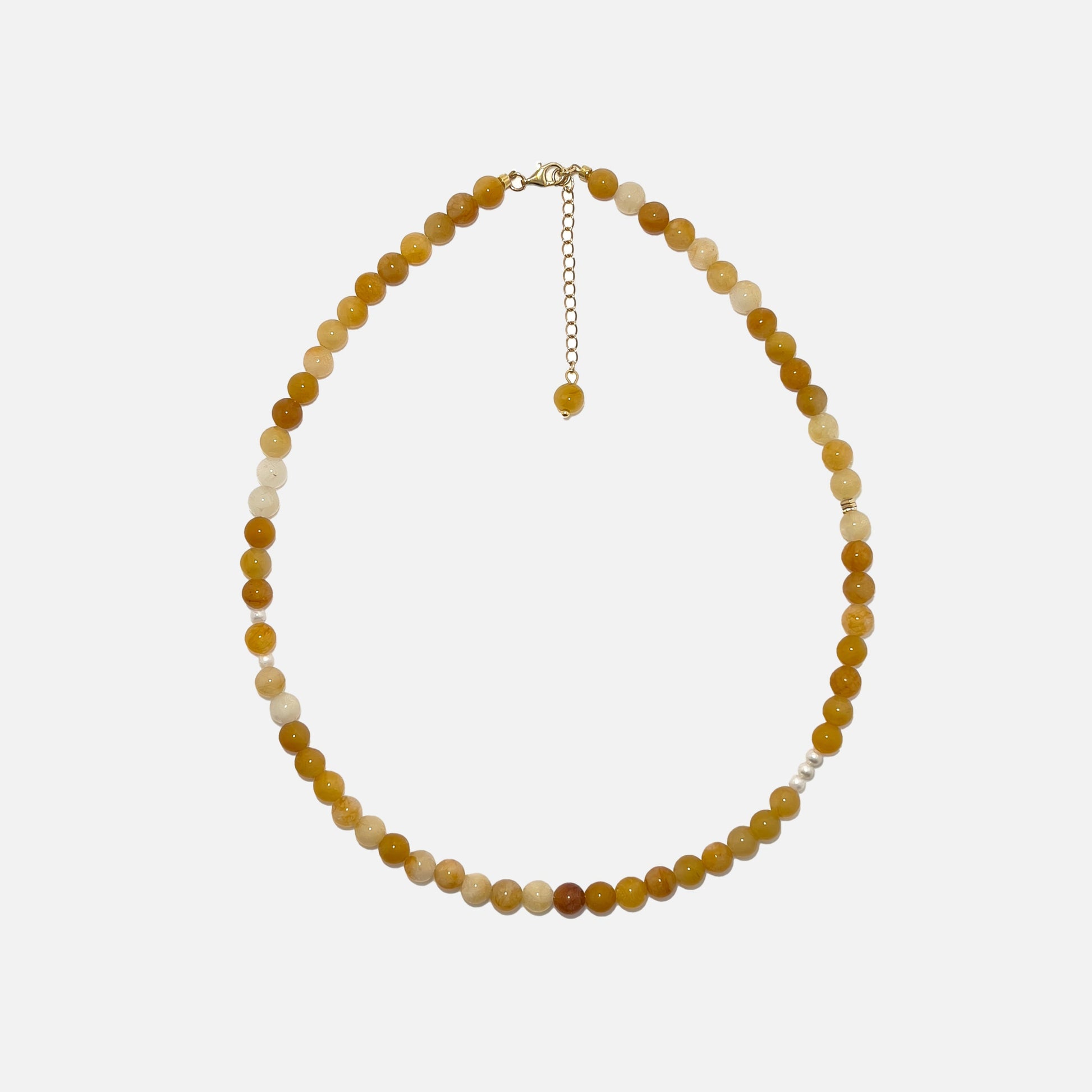 Yellow Aventurine crystal necklace with freshwater pearls and gold accents on a white background. Handmade 6mm gemstone beaded jewelry for confidence and warmth.