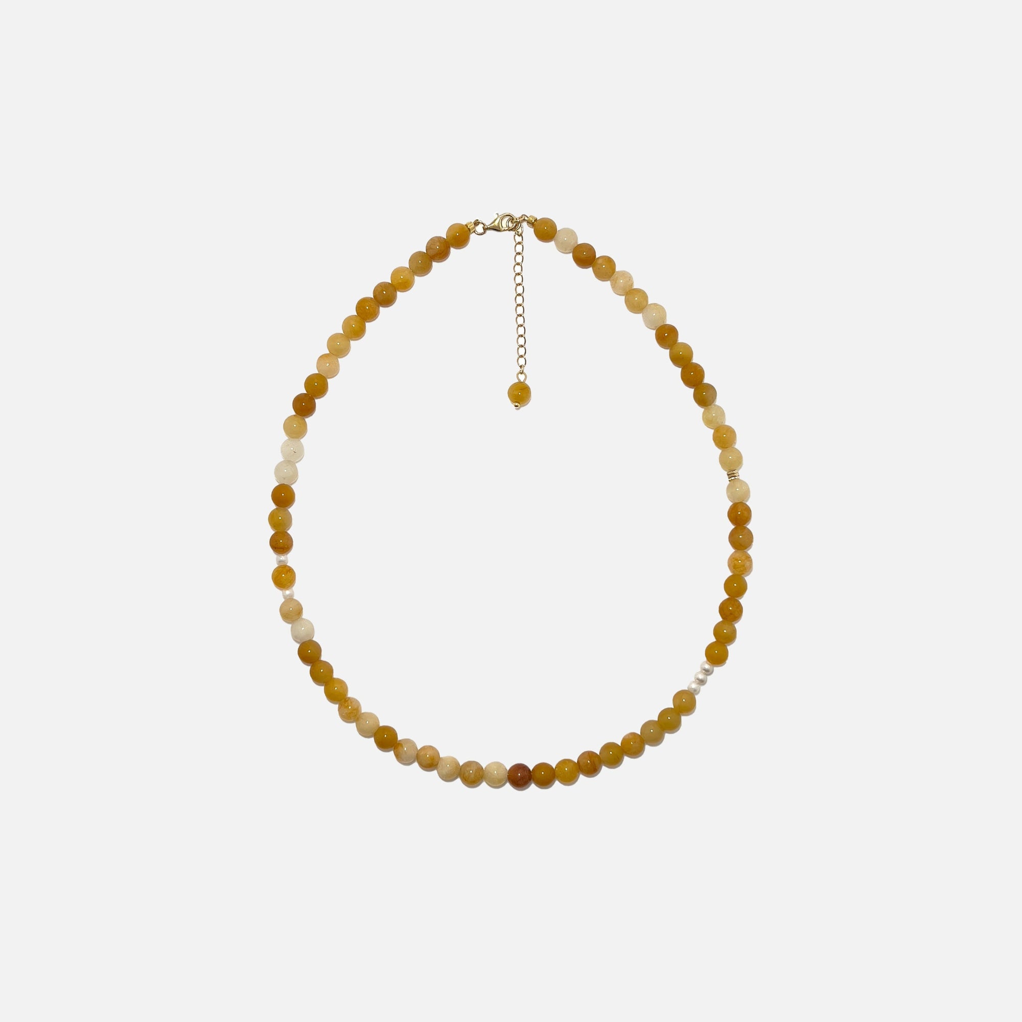 Yellow Aventurine crystal necklace with freshwater pearls and gold accents on a white background. Handmade 6mm gemstone beaded jewelry for confidence and warmth.