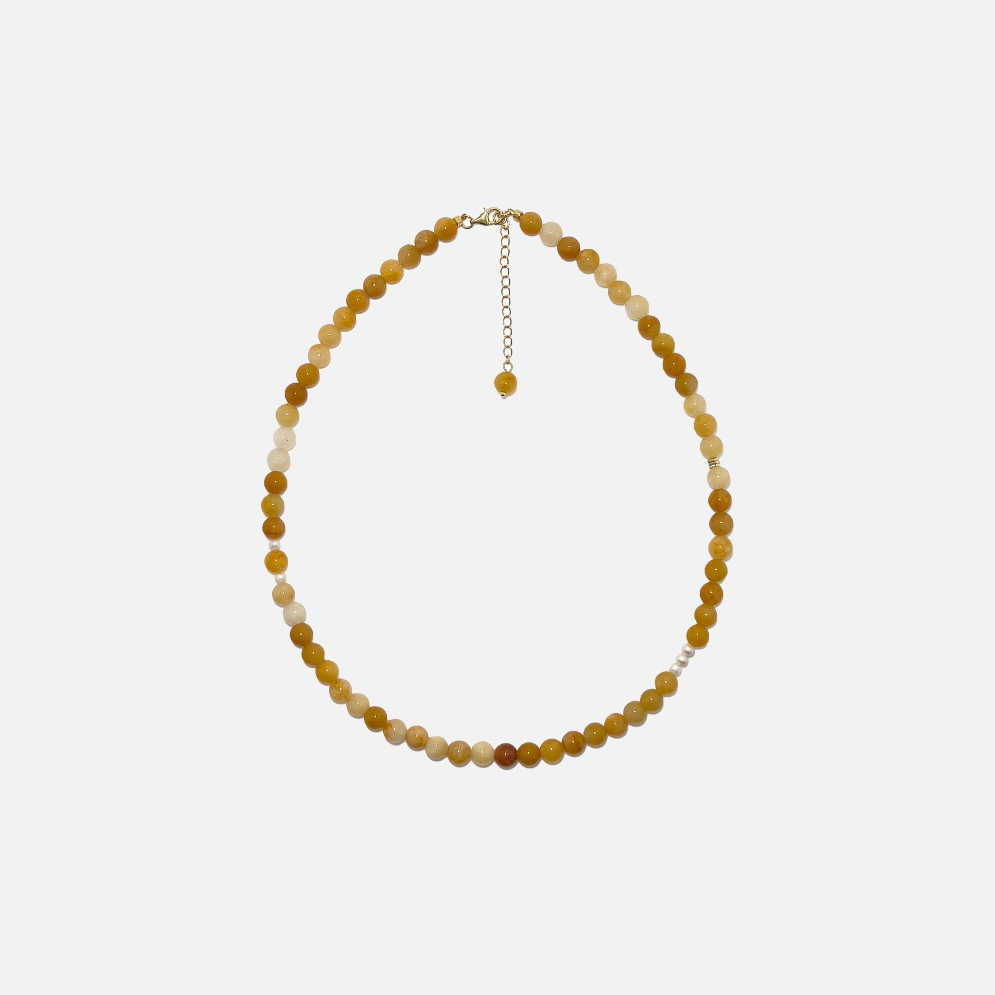 Yellow Aventurine crystal necklace with freshwater pearls and gold accents on a white background. Handmade 6mm gemstone beaded jewelry for confidence and warmth.