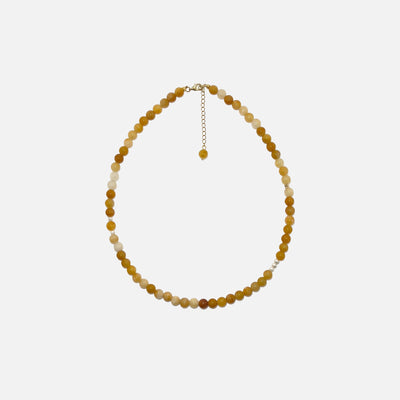 Yellow Aventurine crystal necklace with freshwater pearls and gold accents on a white background. Handmade 6mm gemstone beaded jewelry for confidence and warmth.